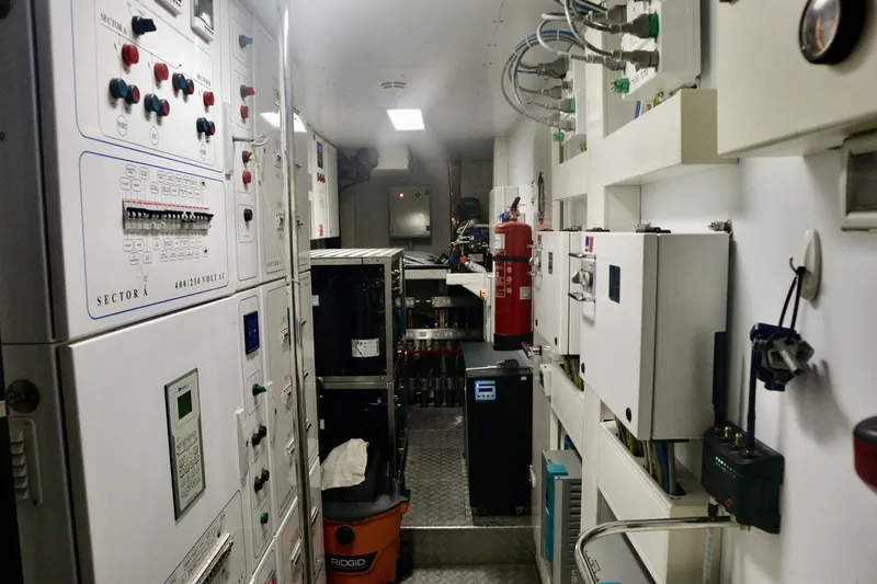 Slide: The Image of Control room of a 2016 Custom Line 97 yacht, featuring panels and equipment. - 28