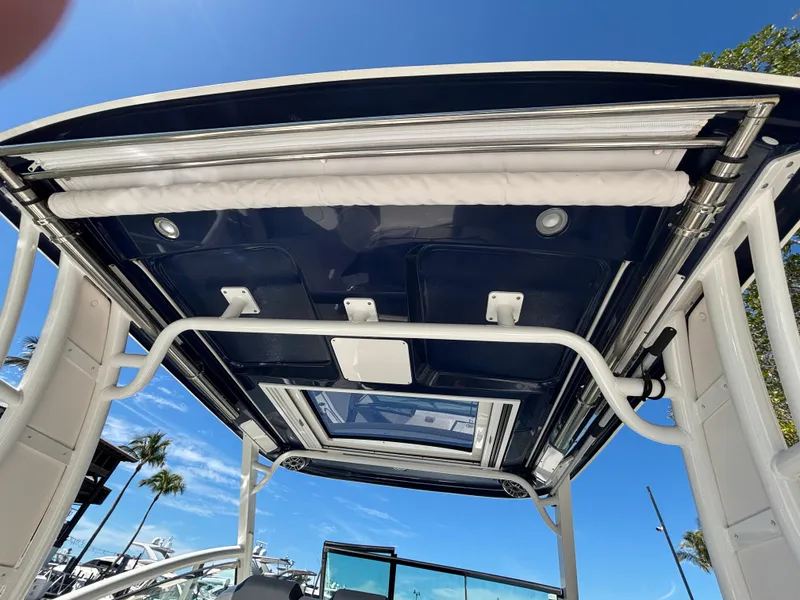 Slide: The Image of 2021 Chaparral 300 OSX boat roof with blue sky background. - 8