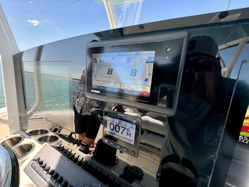 Slide: The Image of 2020 Cobia 350 Center Console dashboard with navigation display and controls. - 36