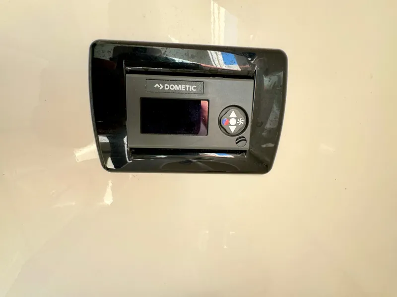 Slide: The Image of Dometic control panel on 2020 Cobia 350 Center Console boat. - 44