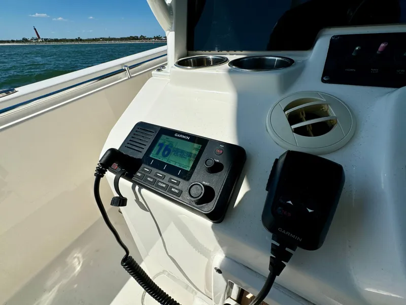 Slide: The Image of Garmin marine radio on 2020 Cobia 350 Center Console boat dashboard. - 48