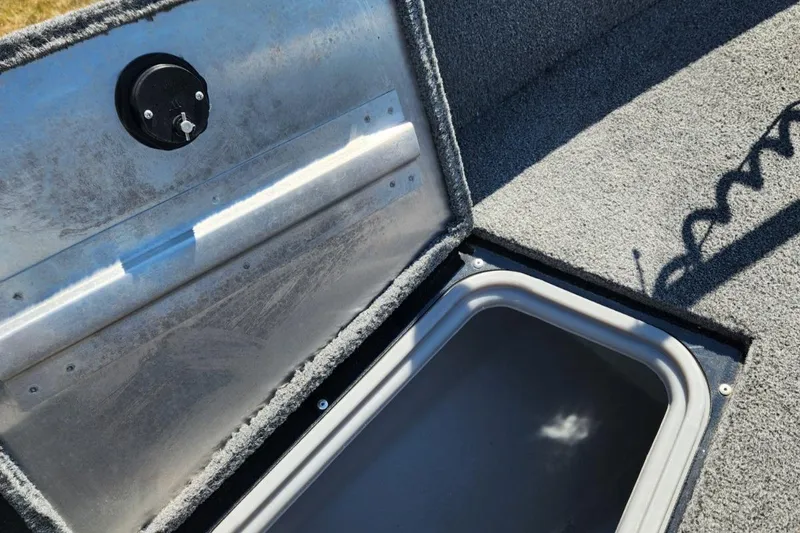 Slide: The Image of Open storage compartment in 2019 Tracker Pro V 175 Guide boat. - 14