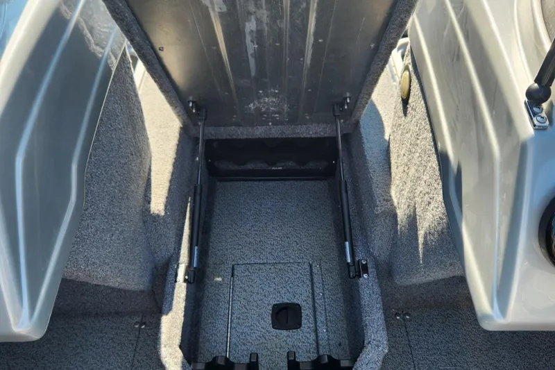 Slide: The Image of 2019 Tracker Pro V 175 Guide boat interior storage compartment open. - 17