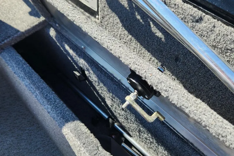Slide: The Image of 2019 Tracker Pro V 175 Guide boat interior storage compartment with carpeted finish. - 20