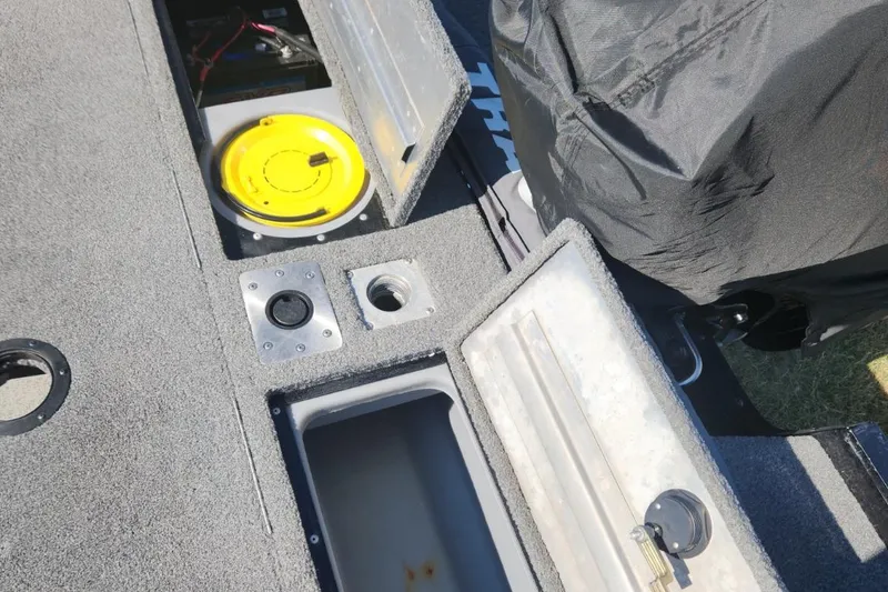 Slide: The Image of 2019 Tracker Pro V 175 Guide boat interior with storage compartments open. - 21