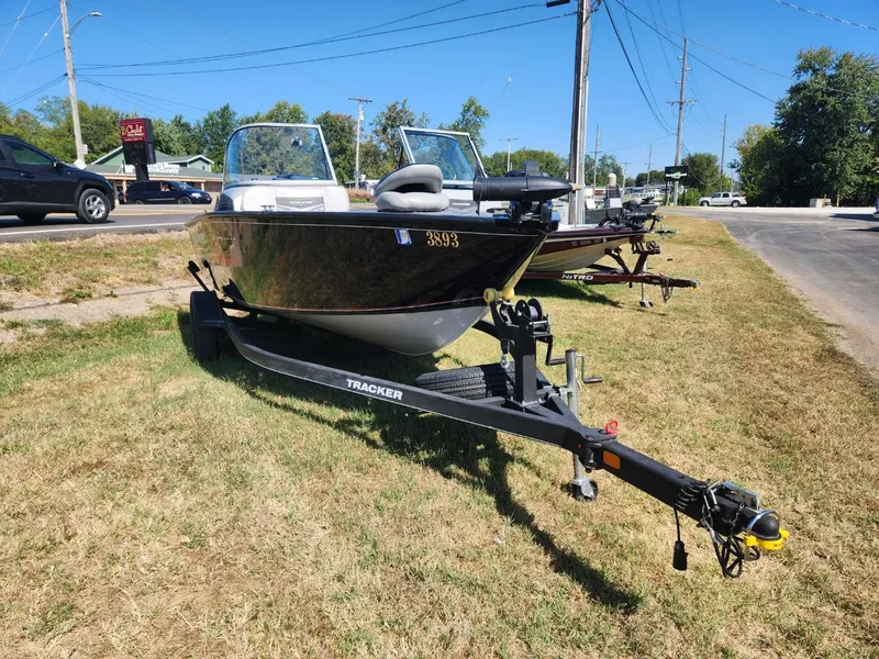 Slide: The Image of 2019 Tracker Pro V 175 Guide boat on trailer, parked on grass. - 4