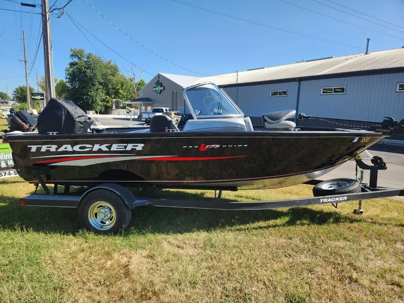 Slide: The Image of 2019 Tracker Pro V 175 Guide boat on trailer, parked outdoors. - 6