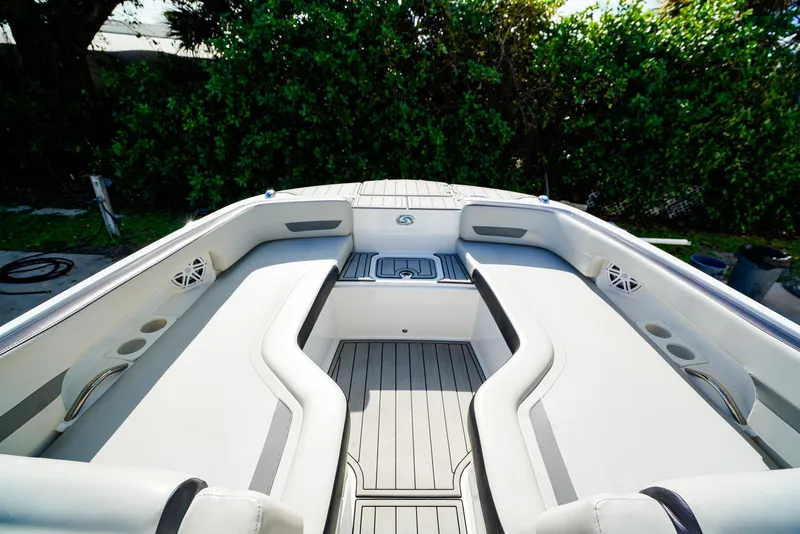 Slide: The Image of 2021 Hurricane SunDeck 235 OB boat interior with spacious seating and sleek design. - 10