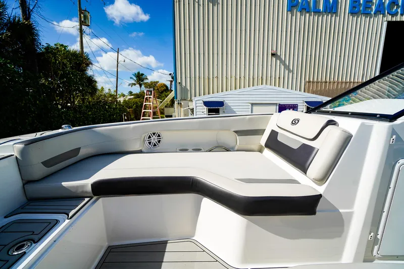 Slide: The Image of 2021 Hurricane SunDeck 235 OB boat interior with cushioned seating and modern design. - 11