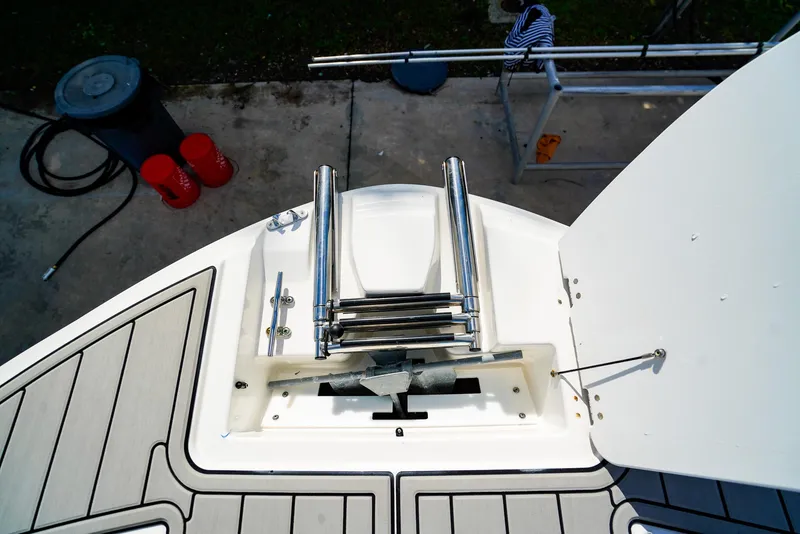 Slide: The Image of 2021 Hurricane SunDeck 235 OB boat ladder and deck view. - 14