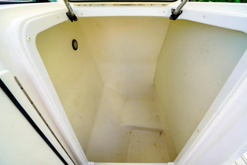 Slide: The Image of 2021 Hurricane SunDeck 235 OB storage compartment, spacious and clean interior. - 15