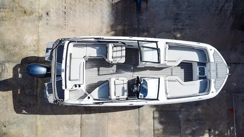 Slide: The Image of 2021 Hurricane SunDeck 235 OB boat, aerial view, showcasing spacious seating and sleek design. - 2