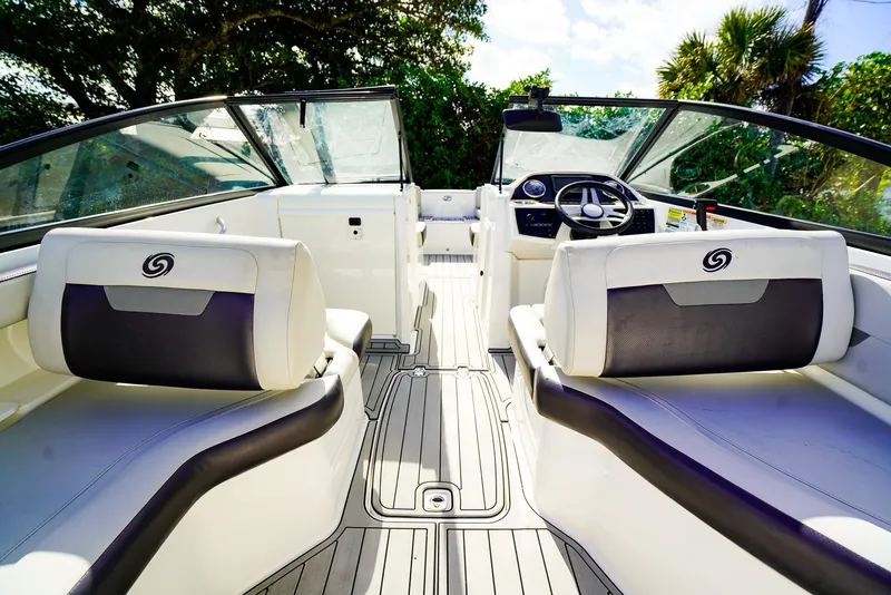 Slide: The Image of 2021 Hurricane SunDeck 235 OB interior with sleek seating and modern dashboard. - 5