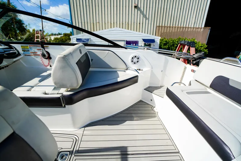Slide: The Image of 2021 Hurricane SunDeck 235 OB interior, featuring sleek seating and modern design elements. - 6