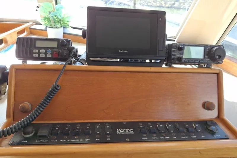 Slide: The Image of Control panel of a 1997 Mainship 350 boat with navigation equipment. - 16