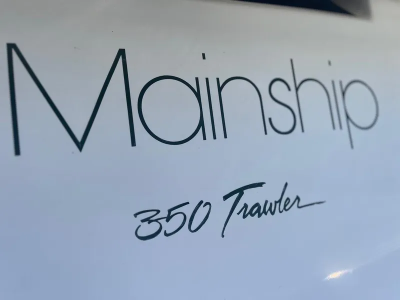 Slide: The Image of Mainship 350 Trawler logo on a 1997 model boat. - 32