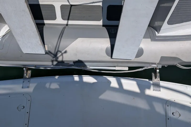Slide: The Image of Overhead view of a 1997 Mainship 350 boat deck with shadows and railing. - 35