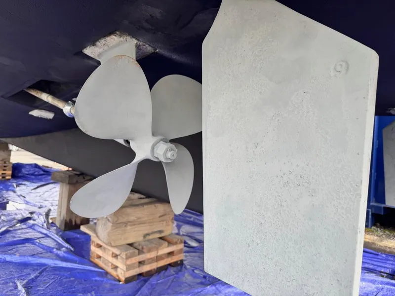 Slide: The Image of Propeller and rudder of 1997 Mainship 350 boat on dry dock. - 4