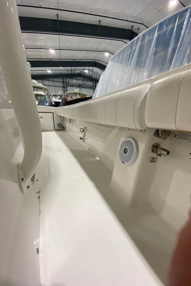 Slide: The Image of 2015 Regulator 34 Center Console boat interior in a storage facility. - 11
