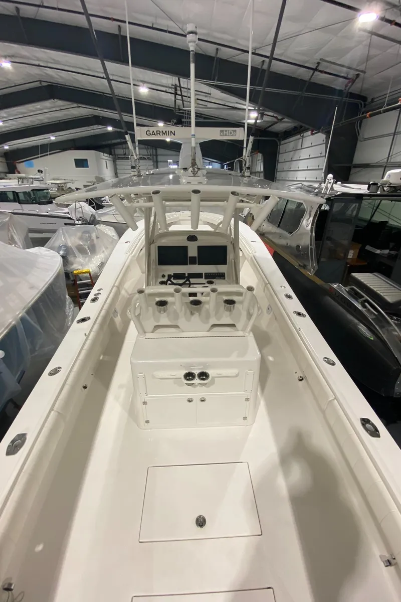 Slide: The Image of 2015 Regulator 34 Center Console boat in indoor storage facility. - 12