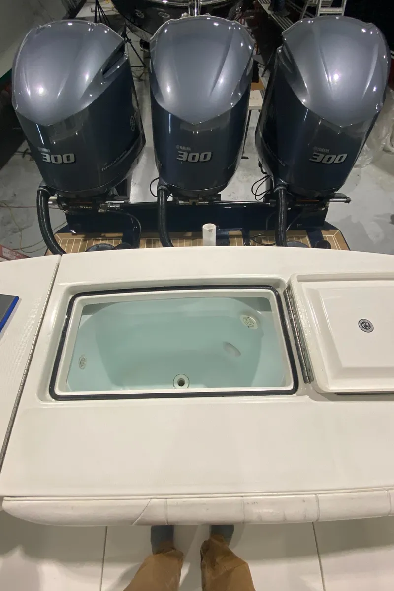 Slide: The Image of 2015 Regulator 34 Center Console with triple 300 horsepower engines, rear view. - 14