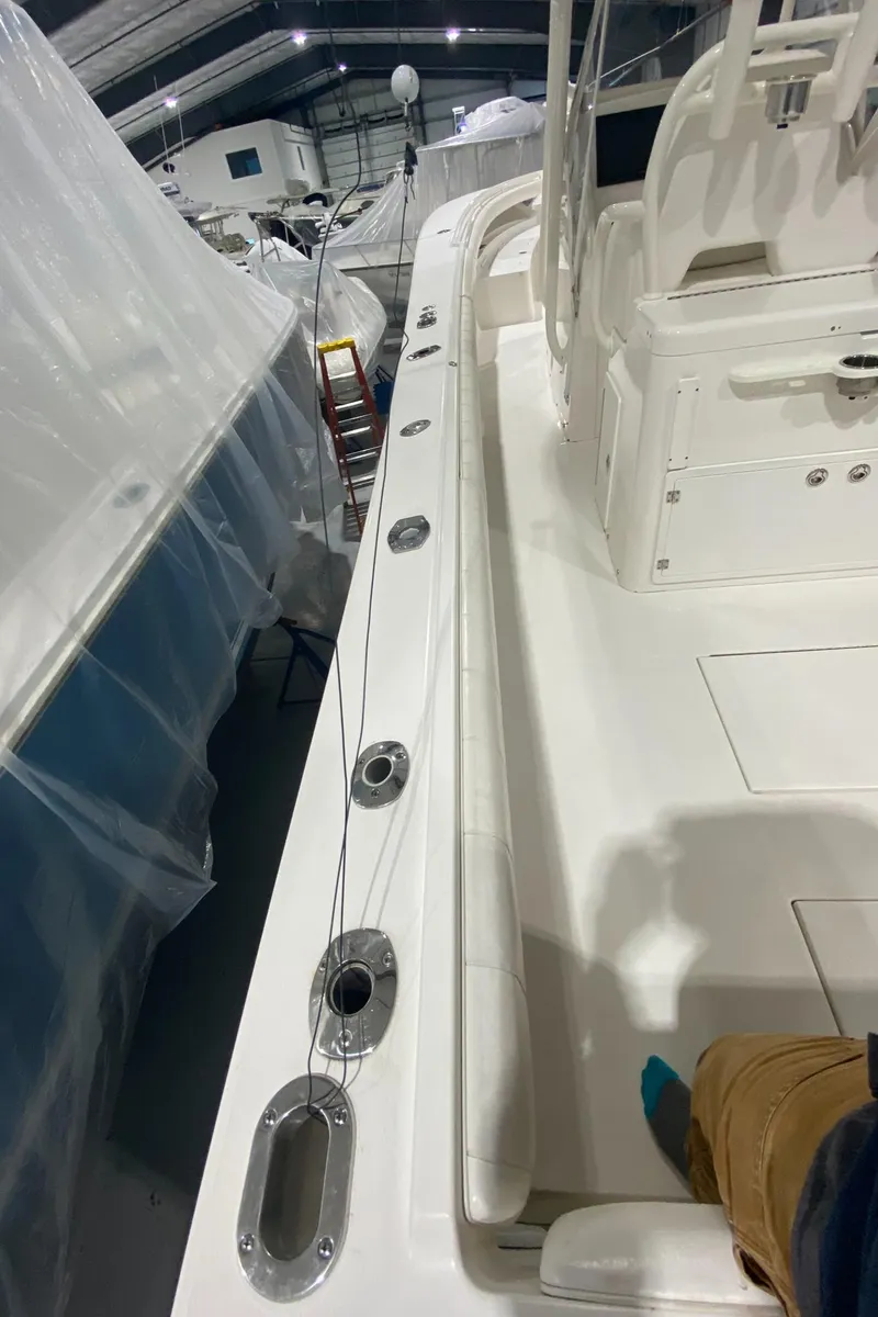 Slide: The Image of 2015 Regulator 34 Center Console boat interior, showcasing deck and seating area. - 19