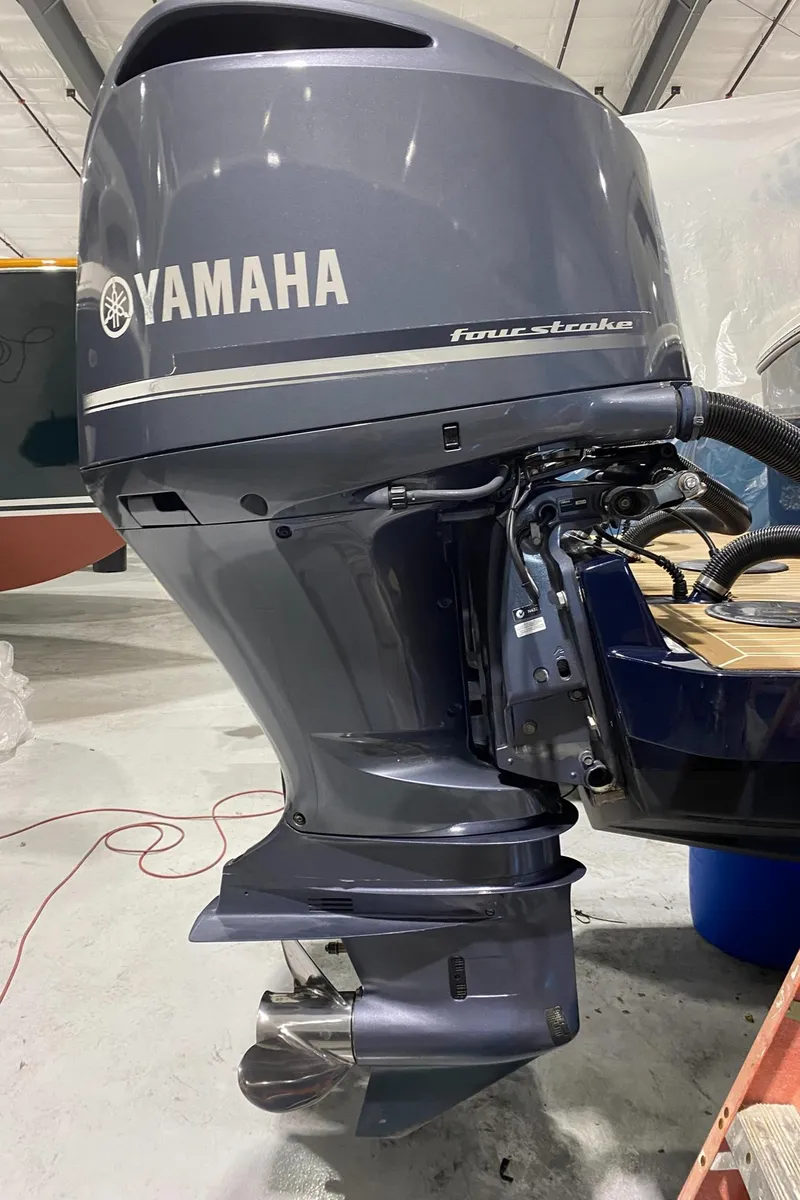 Slide: The Image of Yamaha four-stroke outboard motor on 2015 Regulator 34 Center Console boat. - 28