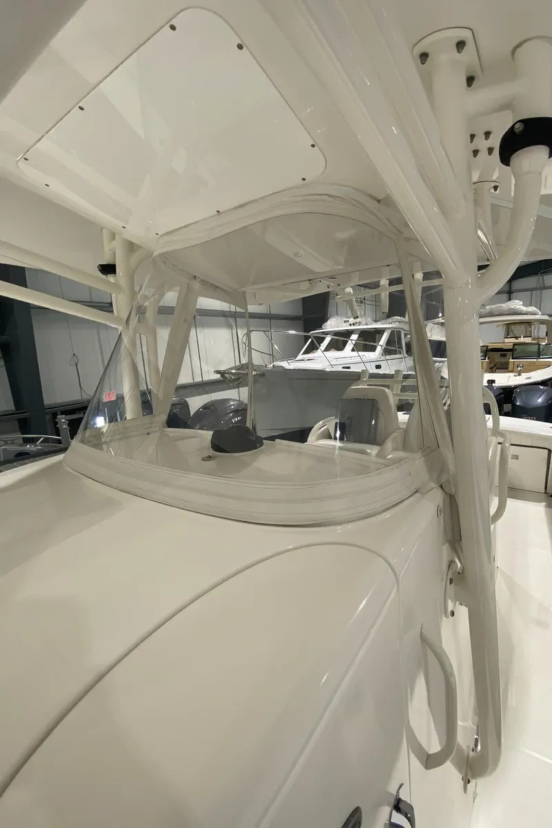 Slide: The Image of 2015 Regulator 34 Center Console boat interior with helm and seating area. - 3