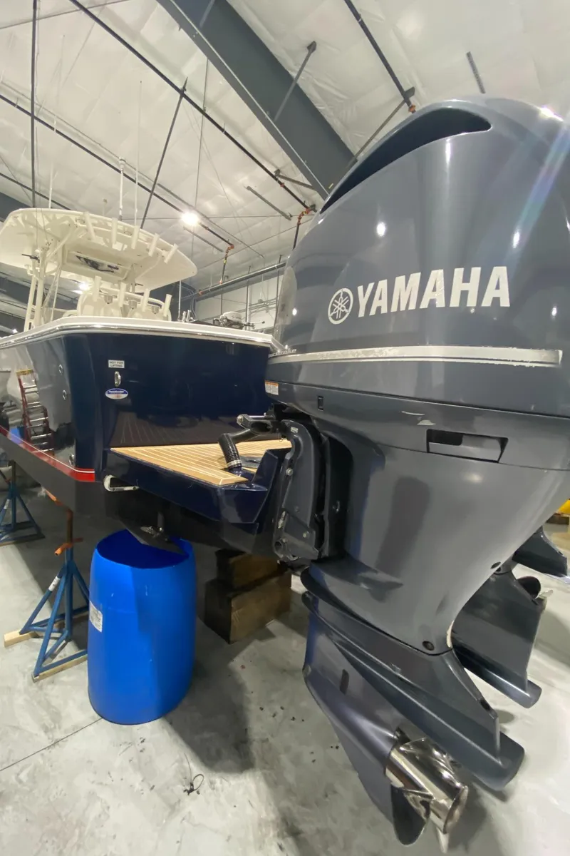 Slide: The Image of 2015 Regulator 34 Center Console with Yamaha outboard in a storage facility. - 30