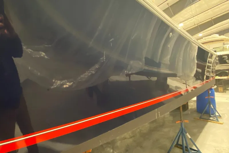 Slide: The Image of 2015 Regulator 34 Center Console boat in a workshop setting. - 31