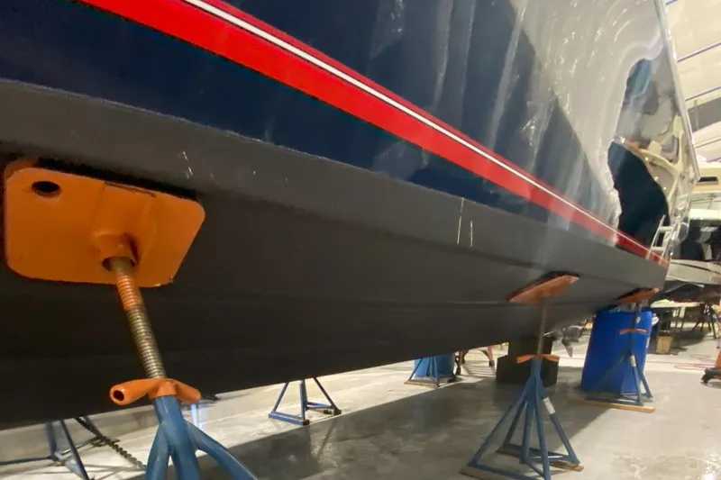 Slide: The Image of 2015 Regulator 34 Center Console boat on stands in a storage facility. - 32