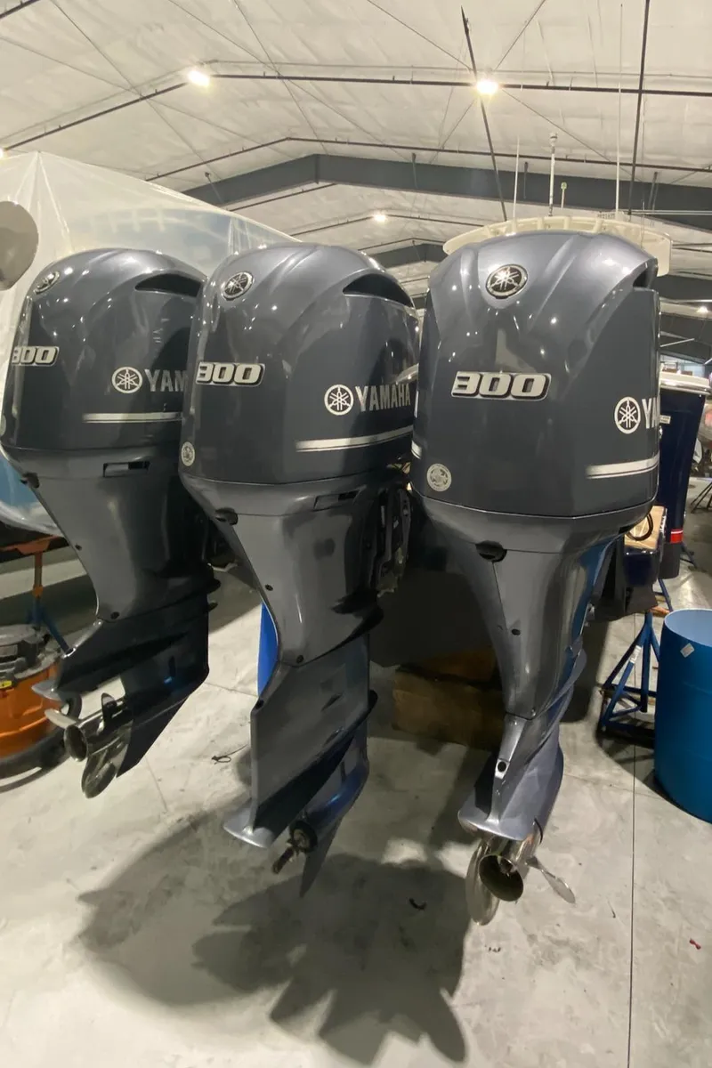 Slide: The Image of Three Yamaha 300 outboard engines on a 2015 Regulator 34 Center Console boat. - 45
