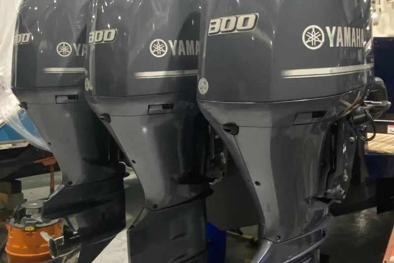 Slide: The Image of Three Yamaha 300 outboard motors on a 2015 Regulator 34 Center Console boat. - 46