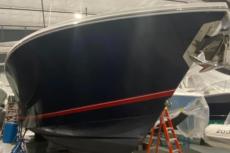 Slide: The Image of 2015 Regulator 34 Center Console boat in storage, side view. - 49