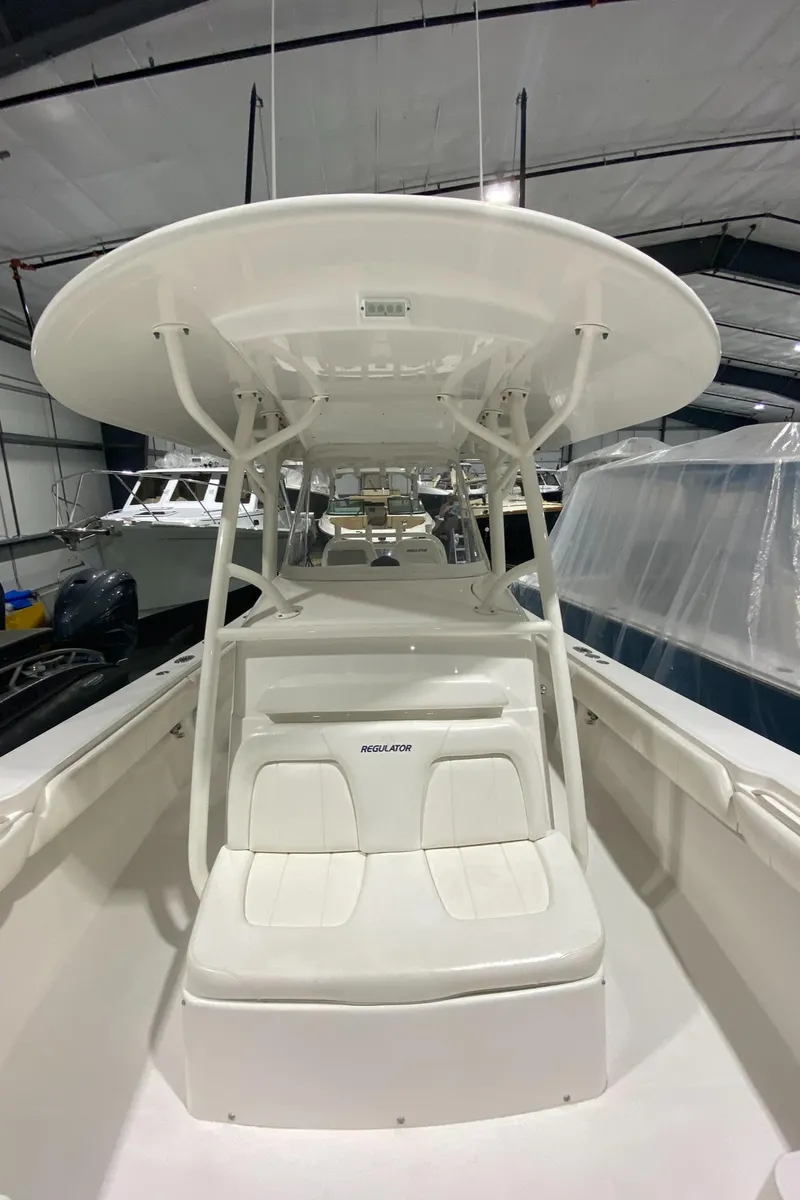 Slide: The Image of 2015 Regulator 34 Center Console boat in a storage facility. - 5