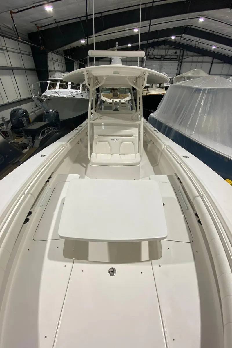 Slide: The Image of 2015 Regulator 34 Center Console boat in indoor storage facility. - 8