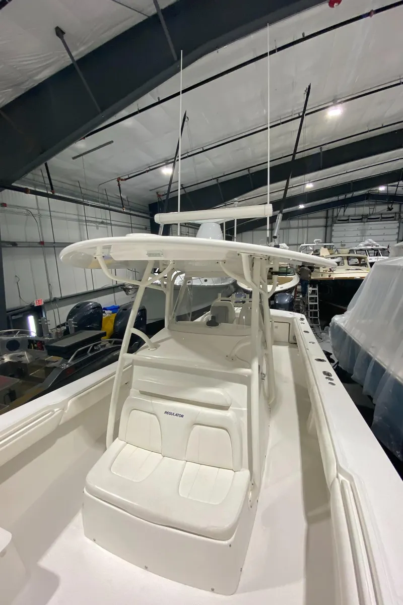 Slide: The Image of 2015 Regulator 34 Center Console boat in indoor storage facility. - 9