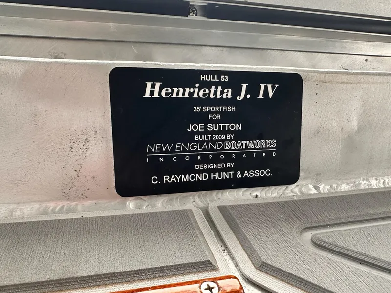 Slide: The Image of Plaque on 2009 New England Boatworks Hunt 35, labeled "Henrietta J. IV," designed by C. Raymond Hunt. - 17