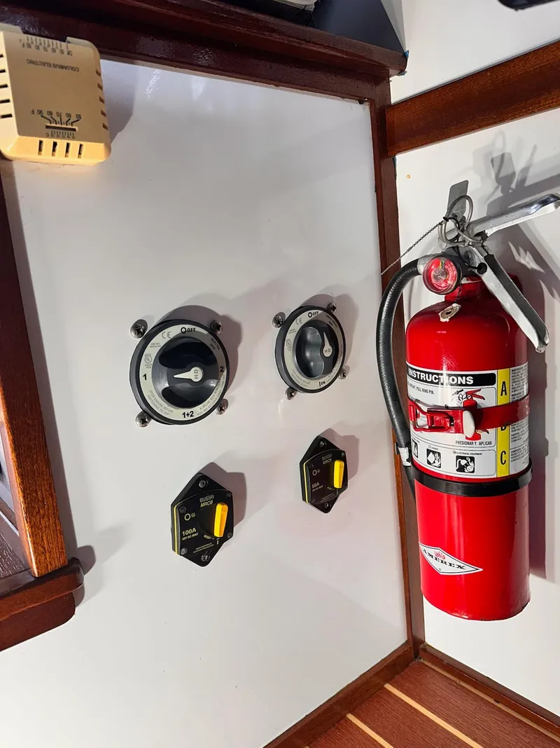 Slide: The Image of Control panel and fire extinguisher on 2009 New England Boatworks Hunt 35 yacht. - 19