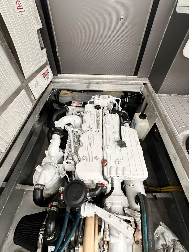 Slide: The Image of Engine compartment of 2009 New England Boatworks Hunt 35, showcasing detailed mechanical components. - 20