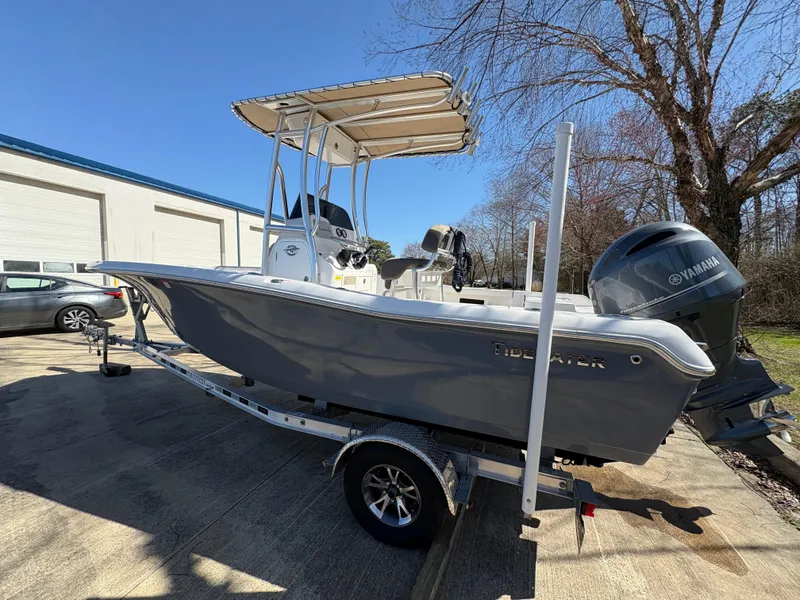 Slide: The Image of 2022 Tidewater 198 CC Adventure boat on trailer, featuring Yamaha outboard motor. - 10