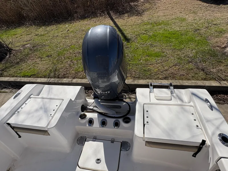 Slide: The Image of 2022 Tidewater 198 CC Adventure boat with outboard motor, viewed from the rear. - 16