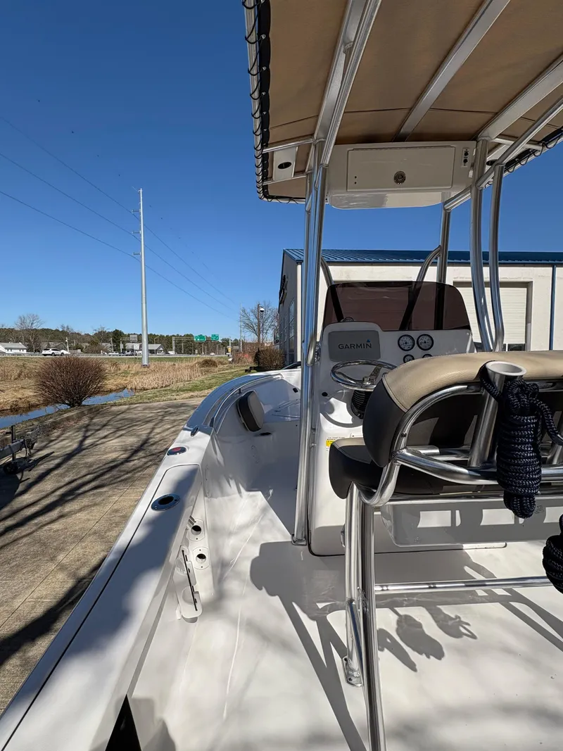 Slide: The Image of 2022 Tidewater 198 CC Adventure boat with T-top and Garmin navigation system. - 18