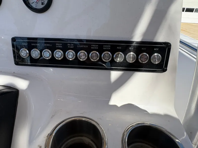 Slide: The Image of Control panel of 2022 Tidewater 198 CC Adventure boat with labeled switches. - 28