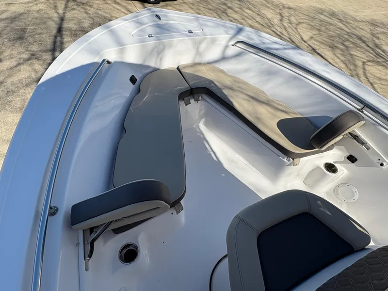 Slide: The Image of 2022 Tidewater 198 CC Adventure boat interior with cushioned seating and sleek design. - 39