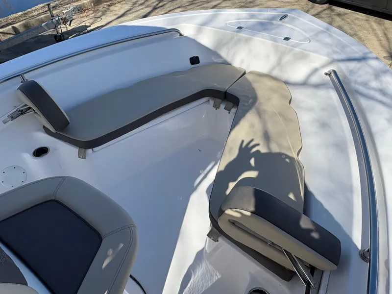 Slide: The Image of 2022 Tidewater 198 CC Adventure boat interior with cushioned seating and stainless steel railings. - 40