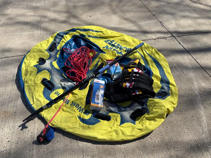 Slide: The Image of Boating gear on inflatable tube, including rope, paddle, and life jacket, for Tidewater 198 CC Adventure. - 42