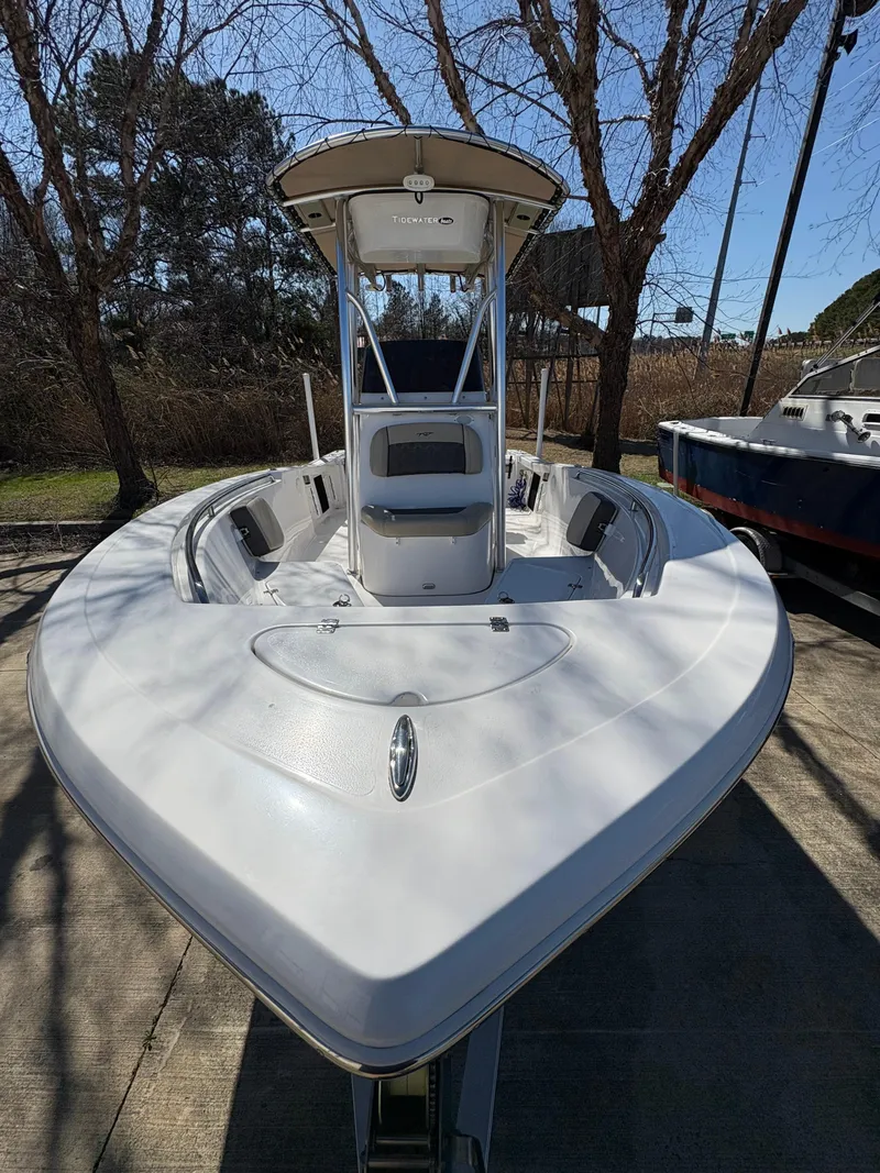 Slide: The Image of 2022 Tidewater 198 CC Adventure boat, white, parked outdoors, front view. - 5
