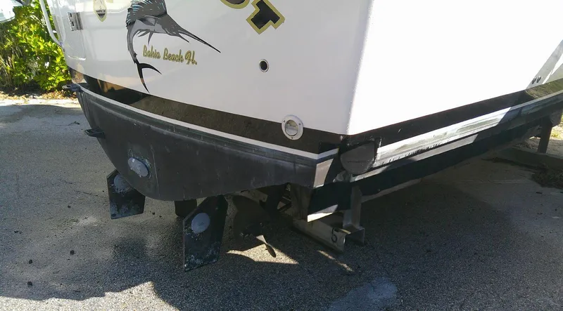 Slide: The Image of 2000 Luhrs Tournament 290 Open boat stern view on pavement. - 11