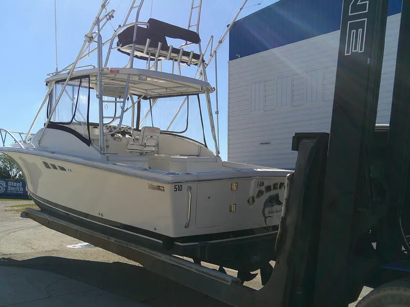 Slide: The Image of 2000 Luhrs Tournament 290 Open boat on forklift, ready for transport. - 14